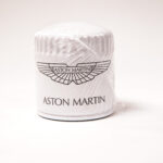 Velocity AP Keep your Aston Martin V12 engine running at its best with this OEM Oil Filter (AG43-6714-AA). Designed for optimal filtration and longevity, this genuine Aston Martin replacement part ensures proper oil flow and contaminant removal, protecting your high-performance engine.