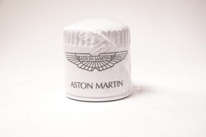Velocity AP Keep your Aston Martin V12 engine running at its best with this OEM Oil Filter (AG43-6714-AA). Designed for optimal filtration and longevity, this genuine Aston Martin replacement part ensures proper oil flow and contaminant removal, protecting your high-performance engine.