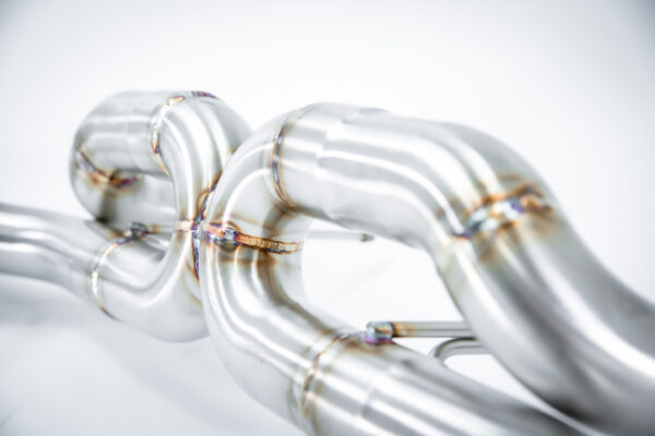VelocityAP Ultimate Exhaust System for Aston Martin V8 and V12 Vantage, featuring mandrel-bent 304-grade stainless steel design with aggressive sound profile and weight reduction.
